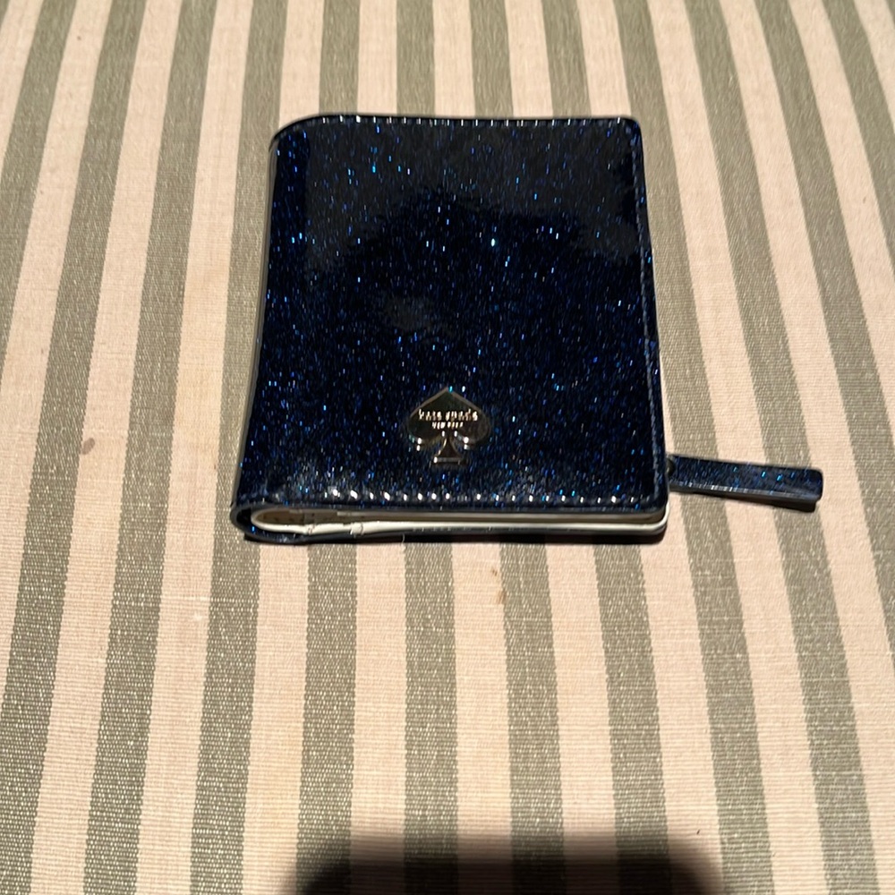 Kate Spade mini wallet in a sparkler navy blue in mint condition.